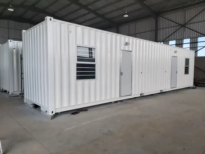 Shipping container converted into a white accommodation unit